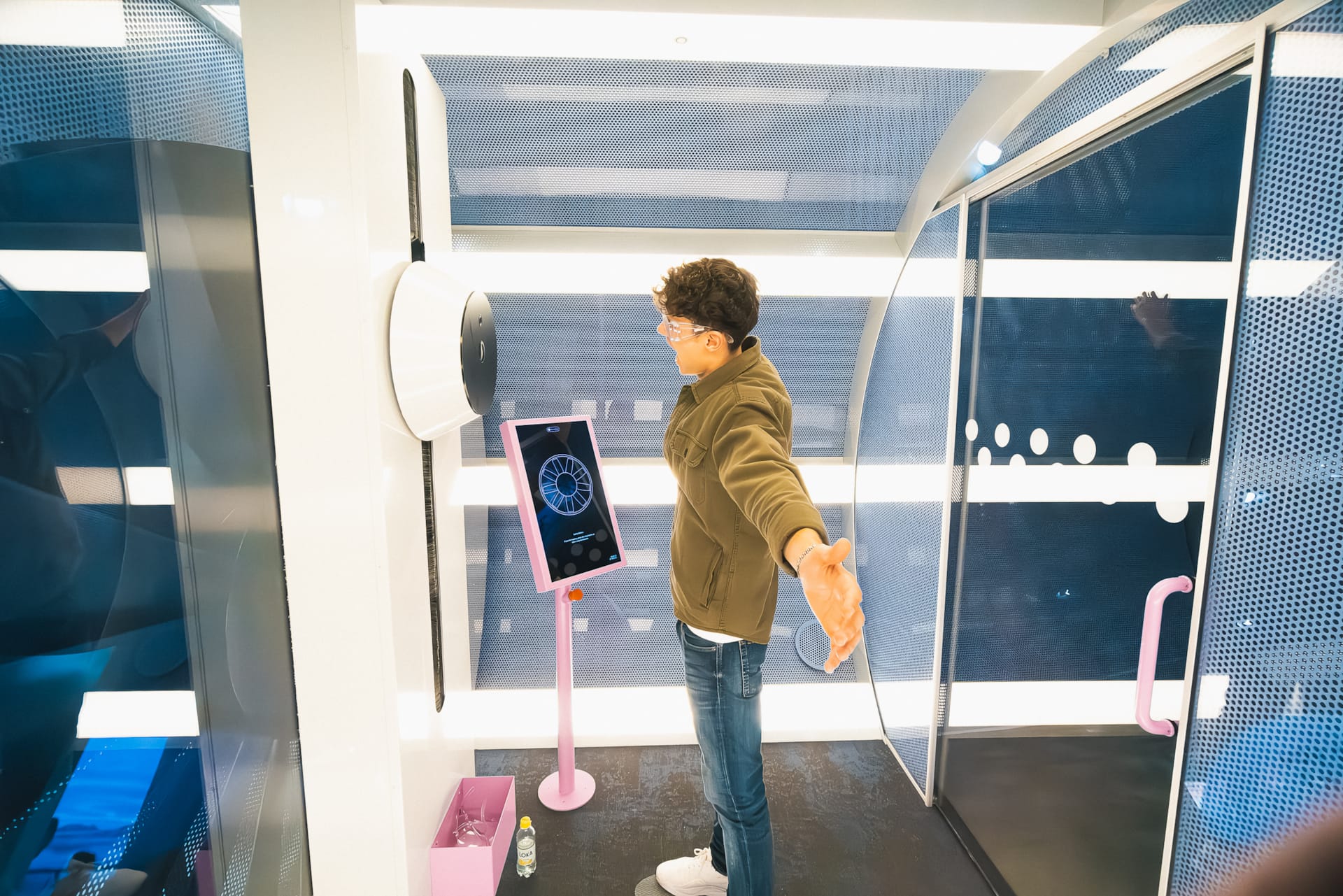 Visitor testing the wind tunnel in the ”World of Volvo Exhibition” at World of Volvo in Gothenburg.